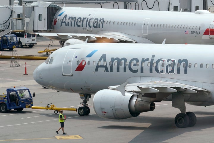 FILE - American Airlines passenger jets prepare for departure, Wednesday, July 21, 2021, near a terminal at Boston Logan International Airport, in Boston. Jurors in a civil lawsuit decided Wednesday, May 11, 2022, that American Airlines did not bear responsibility for an alleged sexual assault against a flight attendant by a celebrity chef who was hired by the airline as an independent contractor. (AP Photo/Steven Senne, File)