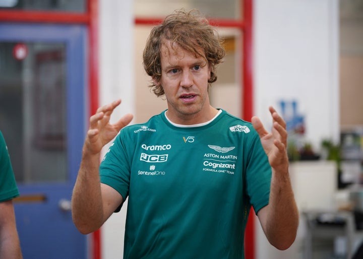 Formula 1 driver Sebastian Vettel meeting young offenders during his visit to HMP Feltham, London to launch a new mechanics workshop for offenders aged 18 to 21 to help them gain formal qualifications.