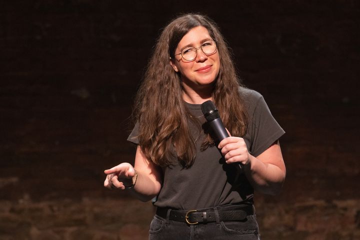 Comedian Alison Leiby on stage during her one-woman performance "Oh God, A Show About Abortion."