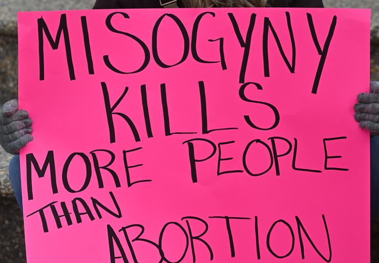 An activist holds a pro-choice poster on Sunday, May 8, in Edmonton, Canada.