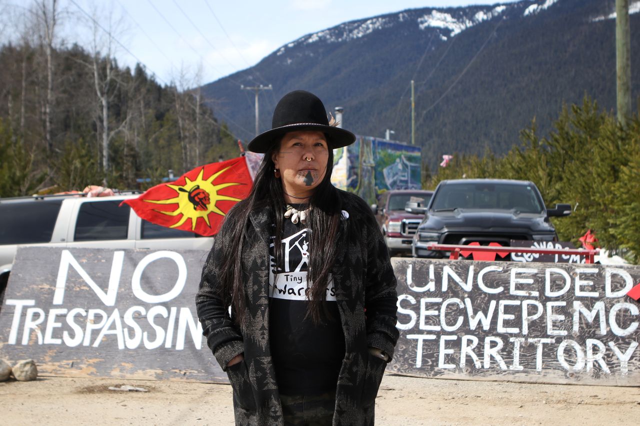 Kanahus Manuel, a member of the Tiny House Warriors, stands in front of an entrance to the Tiny House Warriors village in Blue River, B.C., Canada.