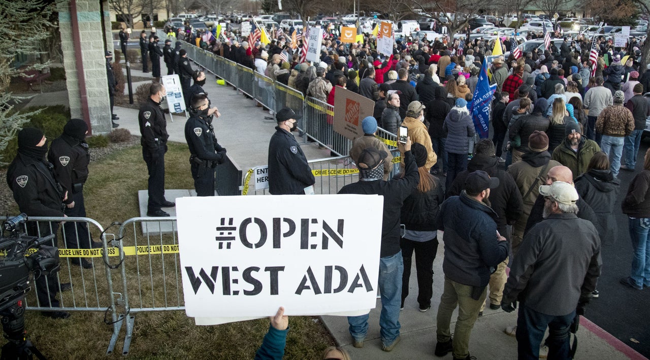 Boise police were forced to create a barrier to keep anti-mask protesters from entering a meeting at the Central District Health offices on Dec. 8, 2020.