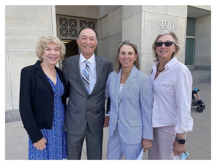 Arslan Guney, second from left, stands outside court with his wife, Linda Guney (left), his attorney, Hollynd Hoskins (second from right), and investigator Kirsten Palmquist.