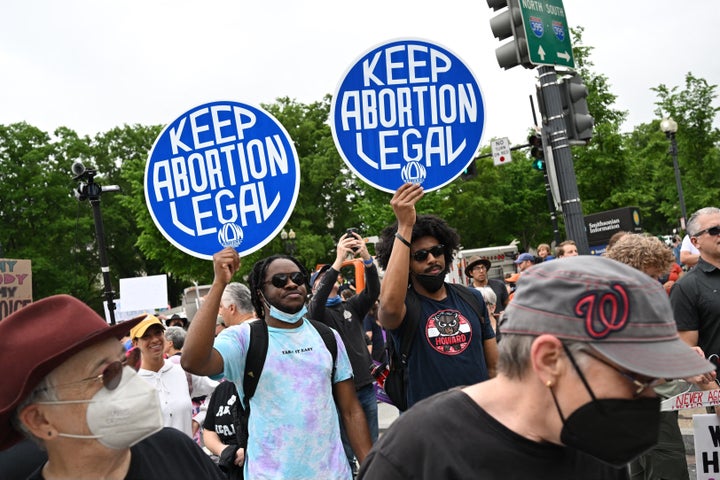 Activists take part in the Bans Off Our Bodies march at the Washington Monument.