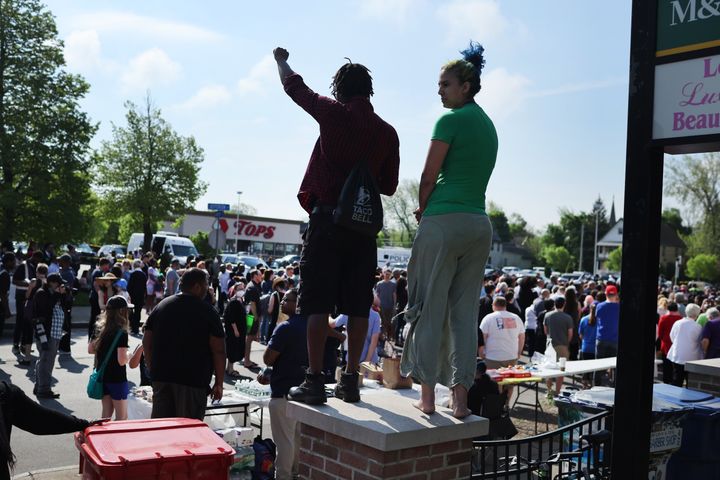 People gather outside of Tops market on May 15, 2022 in Buffalo, New York.