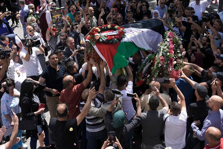 Family, friends and colleagues of slain Al Jazeera journalist Shireen Abu Akleh carry her coffin to a hospital in the east Jerusalem neighborhood of Sheikh Jarrah, Thursday, May 12, 2022. Abu Akleh, a Palestinian-American reporter who covered the Mideast conflict for more than 25 years, was shot dead during an Israeli military raid in the West Bank town of Jenin.