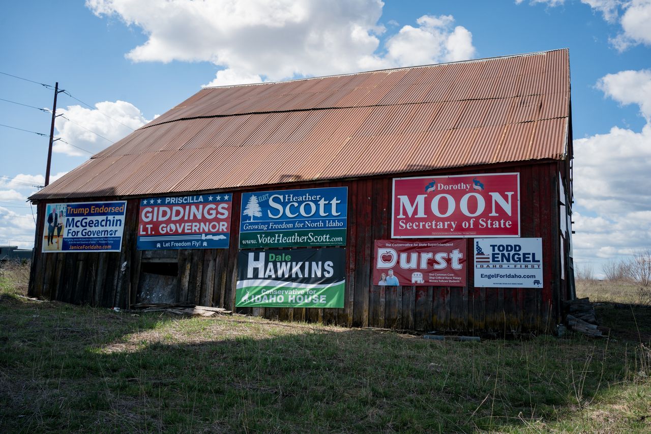 A barn near Coeur d'Alene, Idaho, on March 30, 2022, covered in signs for far-right candidates in the upcoming Republican primary.