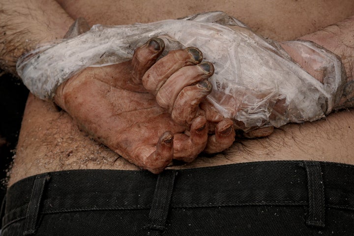 A dead body of a man with his hands tied behind his back lies on the pavement in Bucha, Ukraine, on April 3, 2022.
