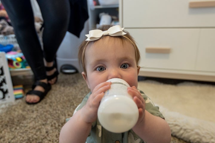 Nine-month-old Olivia Wetzel enjoys a bottle of formula on May 16 in Victor, Idaho. Olivia's mother, Mollie Wetzel, sourced some formula on a community Facebook page where a mother with extra formula was offering what she no longer needed to anyone in need due to the current shortage.