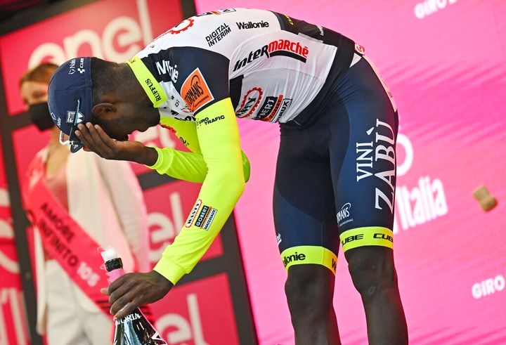 Eritrea's Biniam Girmay injured himself when he popped a champagne cork into his eye during the podium celebration. (Massimo Paolone/LaPresse via AP)