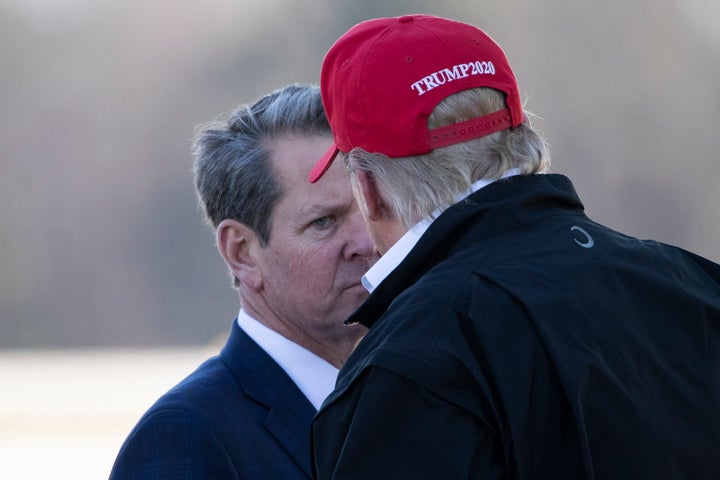 Georgia Gov. Brian Kemp (R) greets President Donald Trump as he steps off Air Force One at Dobbins Air Reserve Base in Marietta, Georgia, in March 2020.