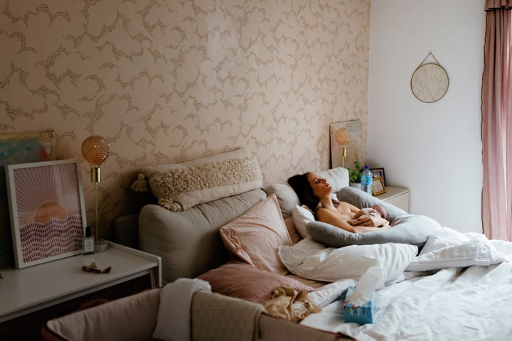 The author and her baby in bed.