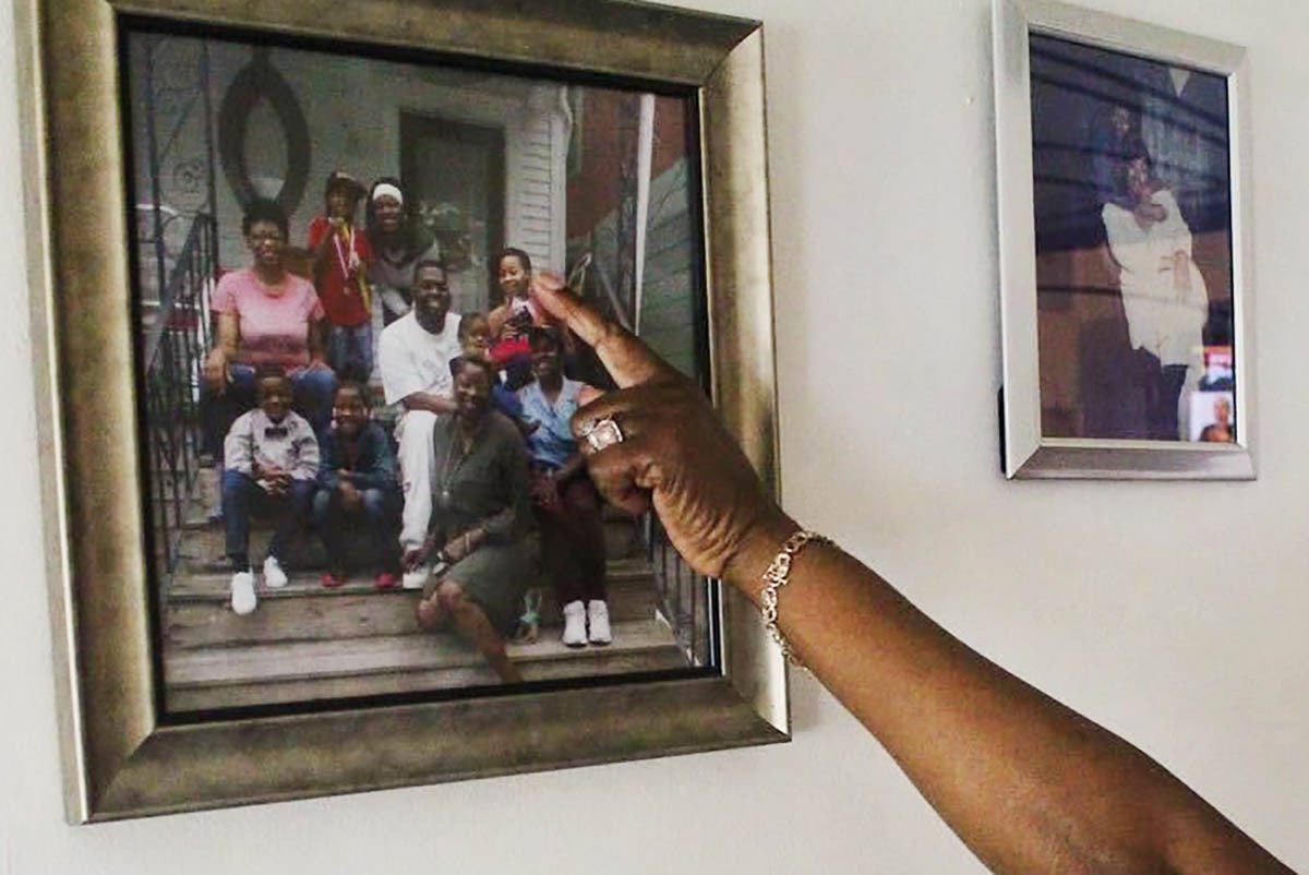 Priscilla points to a photo of her daughter, Schacana.