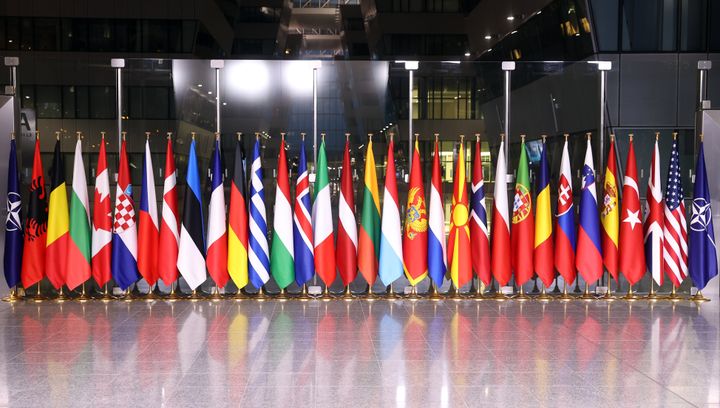 Flags of member states of NATO are seen before a meeting of NATO foreign ministers at NATO headquarters, in Brussels, on April 7, 2022. 