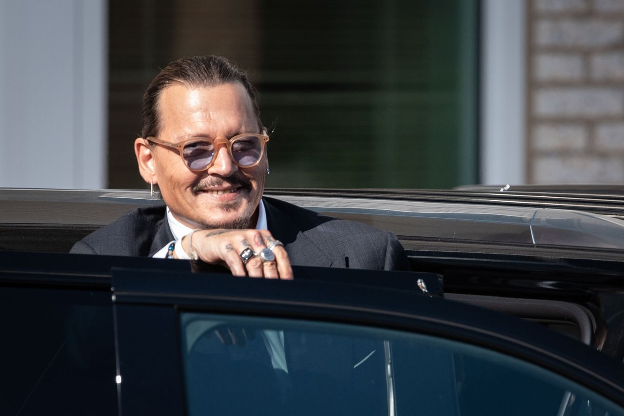 Johnny Depp arrives at the Fairfax County, Virginia, courthouse every day blaring reggae music and waving to fans. 
