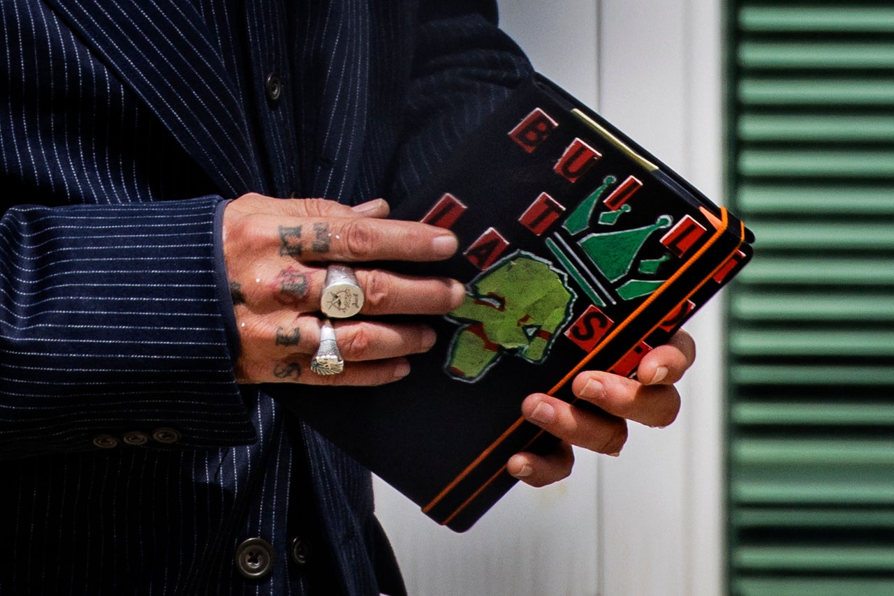 During the trial, Depp was often seen drawing or writing at his desk.
