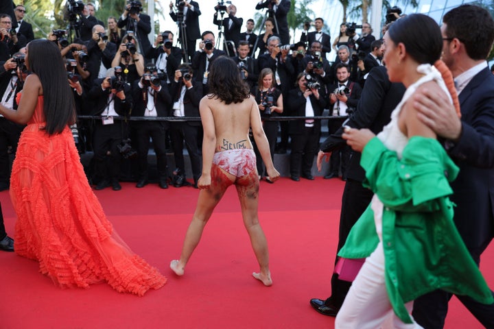 Woman Strips On Cannes Red Carpet To Protest Russian Rapes In Ukraine |  HuffPost Latest News