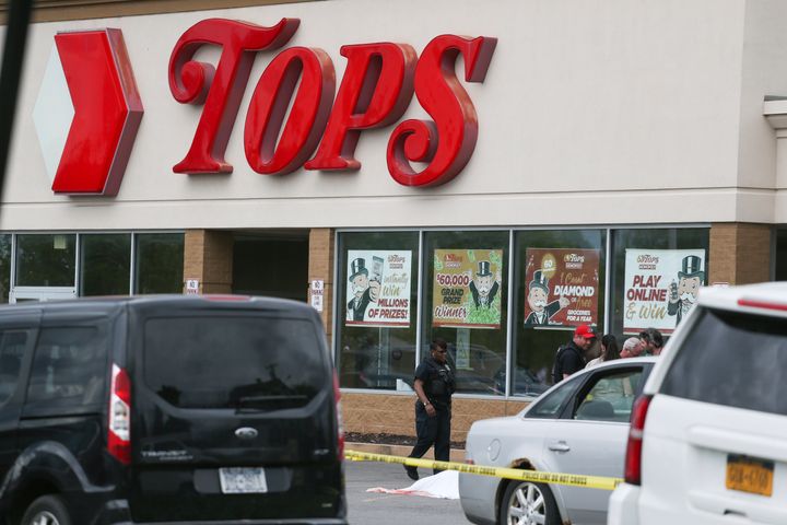 Police investigate the shooting at Tops supermarket on Saturday, May 14, 2022, in Buffalo, New York.