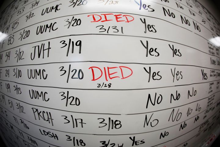 This May 13, 2020 photo made with a fisheye lens shows a list of the confirmed COVID-19 cases in Salt Lake County early in the coronavirus pandemic at the Salt Lake County Health Department, in Salt Lake City. After a weekend of gun violence in America, Saturday, May 14, 2022, when shootings killed and wounded people grocery shopping, going to church and simply living their lives, the nation marked a milestone of 1 million deaths from COVID-19.
