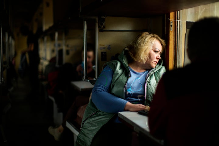 People fleeing from heavy shelling board an evacuation train at Pokrovsk train station, in Pokrovsk, eastern Ukraine, on May 22, 2022.