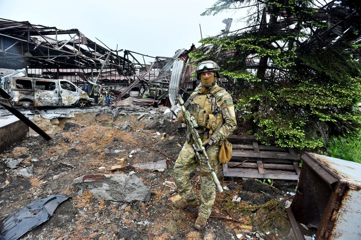 A Russian serviceman stands guard in Mariupol