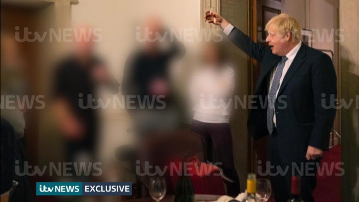 ITV handout photo dated 13/11/20 of a photograph obtained by ITV News of the Prime Minister raising a glass at a leaving party on 13th November 2020, with bottles of alcohol and party food on the table in front of him. Issue date: Monday May 23, 2022.