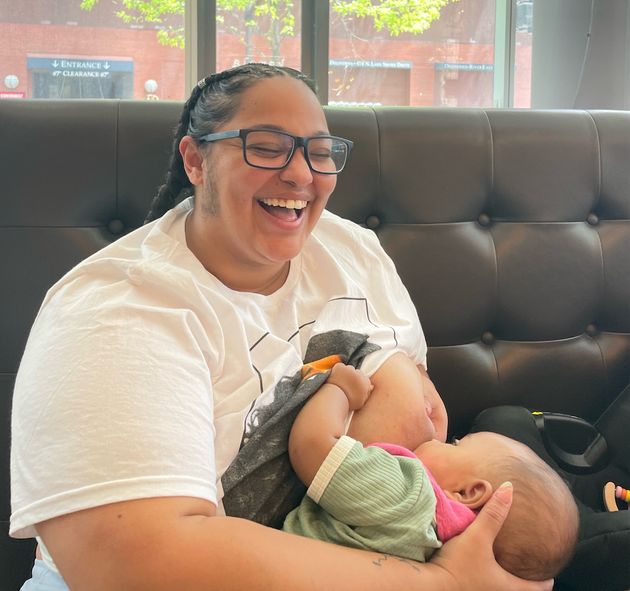 Charli Michelé, a dancer and model, feeds her daughter on the go. 