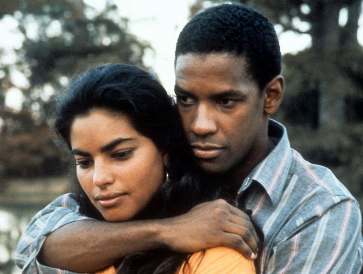 Denzel Washington holds Sarita Choudhury in a scene from the 1991 film "Mississippi Masala." 
