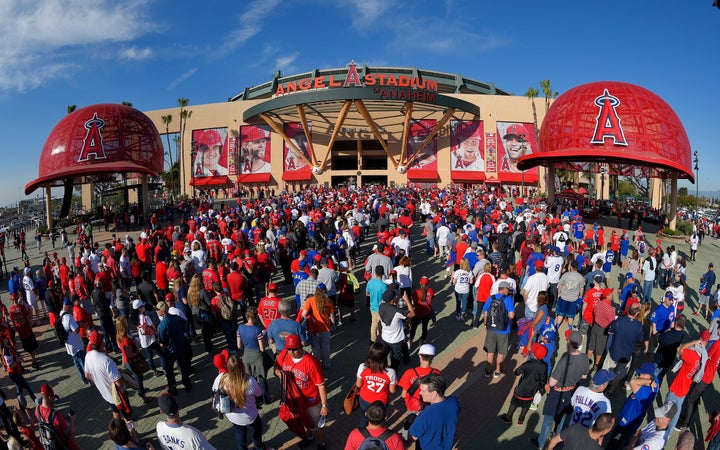 FILE - Fans line up outside Angel Stadium of Anaheim for an opening day baseball game between the Los Angeles Angels and the Chicago Cubs in Anaheim, Calif., on April 4, 2016. The mayor of the Southern California city of Anaheim is resigning amid a swirling political scandal over the sale of Angel Stadium to the baseball team. Mayor Harry Sidhu is quitting his post effective Tuesday, May 24, 2022, his lawyer, Paul S. Meyer, said in a statement Monday. He said the stadium negotiations were lawful and that Sidhu didn't ask for campaign contributions linked to the deal. (AP Photo/Mark J. Terrill, File)