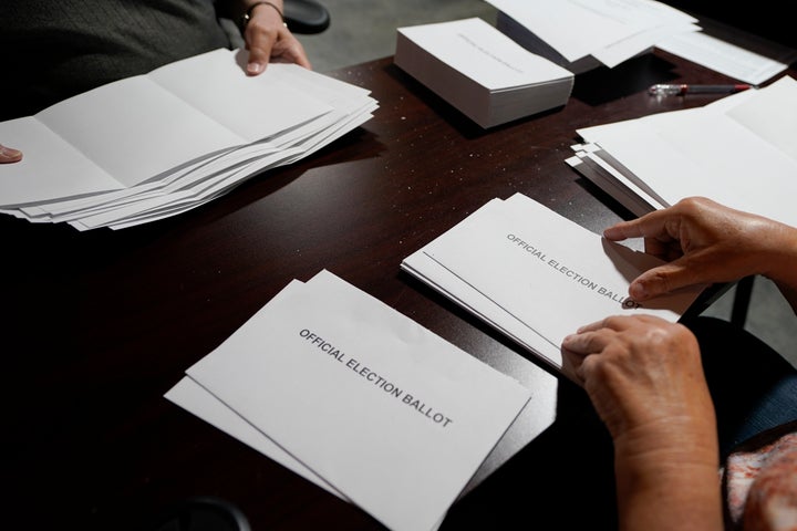 Election workers continue the process of counting ballots for the Pennsylvania primary election, Wednesday, May 18, 2022, at the Mercer County Elections Board in Mercer, Pa. Vote counting continues as Republican candidates Dr. Mehmet Oz and David McCormick are locked in a too-early-to-call race for Pennsylvania's hotly contested Republican nomination for an open U.S. Senate seat.