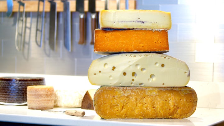 Aged gouda, Swiss cheese, Parmesan and Morbier with ash ready for sale.