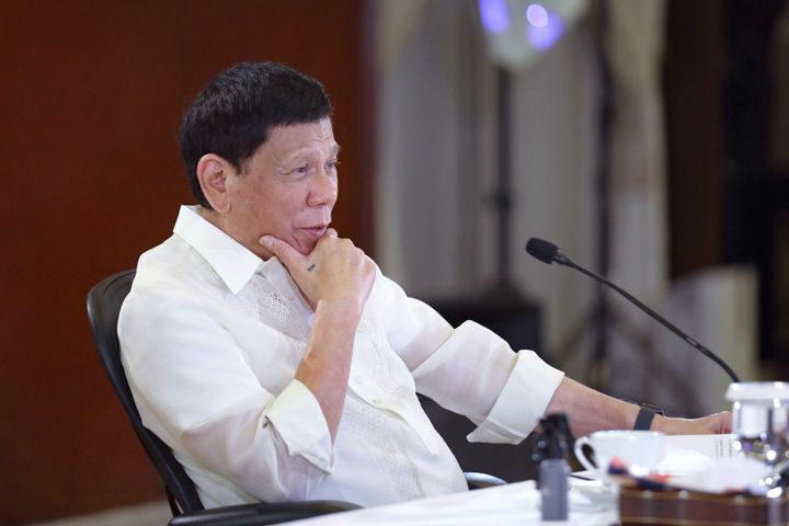 In this photo provided by the Malacanang Presidential Photographers Division, Philippine President Rodrigo Duterte gestures during a meeting with government officials at the Malacanang presidential palace in Manila, Philippines on May 23, 2022.