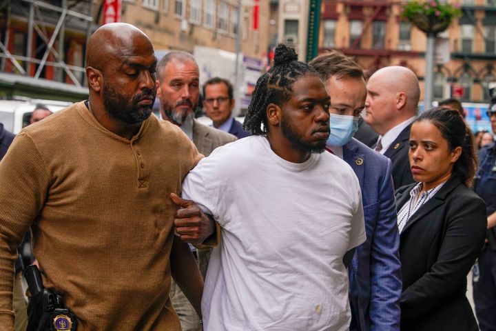 Andrew Abdullah is seen being escorted into the Fifth precinct in New York on Tuesday.