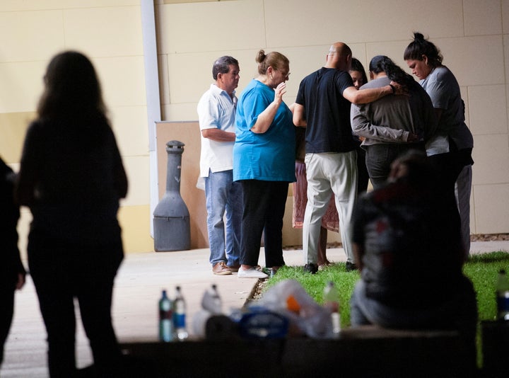 Members of City Church from San Antonio pray outside the SSGT Willie de Leon Civic Center after a mass shooting at Robb Elementary School in Uvalde, Texas, U.S., May 24, 2022. REUTERS/Nuri Vallbona