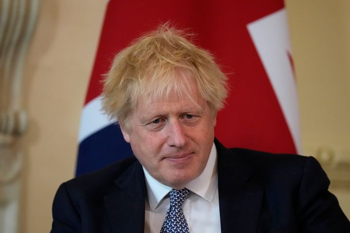 British Prime Minister Boris Johnson listens to the Amir of Qatar Sheikh Tamim bin Hamad Al Thani speak at the start of their meeting inside 10 Downing Street, in London, May 24, 2022.