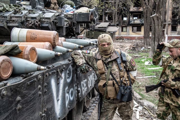 MARIUPOL, UKRAINE - 2022/04/18: A Russian soldier leans on a Russian T-80 tank lined with shells in Mariupol. The battle between Russian / Pro Russian forces and the defending Ukrainian forces lead by the Azov battalion continues in the port city of Mariupol. (Photo by Maximilian Clarke/SOPA Images/LightRocket via Getty Images)