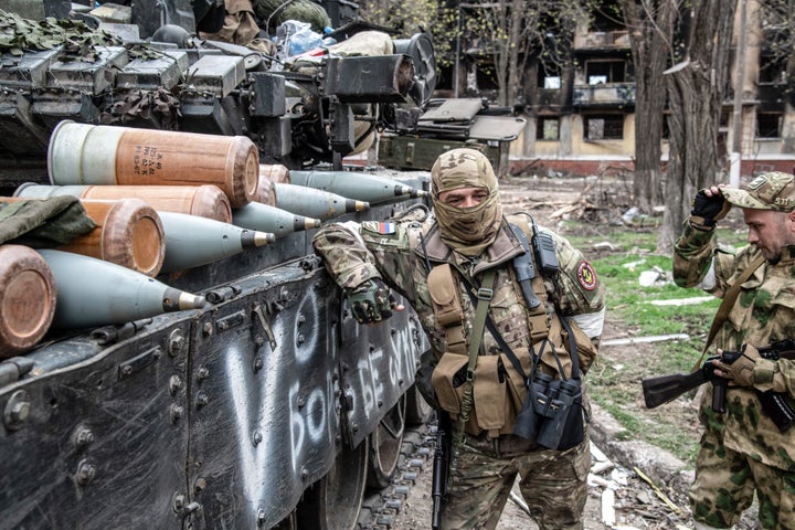 MARIUPOL, UKRAINE - 2022/04/18: A Russian soldier leans on a Russian T-80 tank lined with shells in Mariupol. The battle between Russian / Pro Russian forces and the defending Ukrainian forces lead by the Azov battalion continues in the port city of Mariupol. (Photo by Maximilian Clarke/SOPA Images/LightRocket via Getty Images)