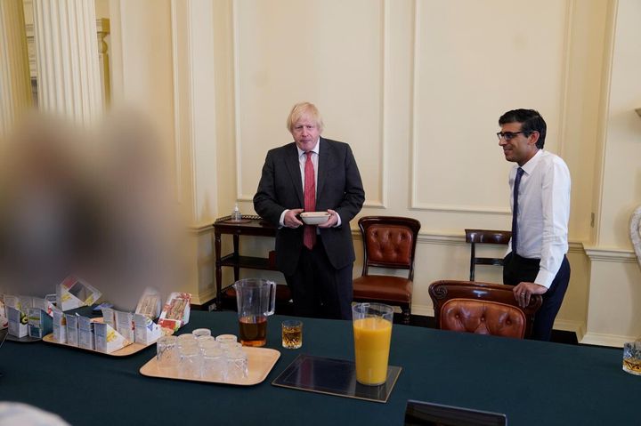 This photo of Boris Johnson and Rishi Sunak on the PM's birthday is included in the Gray report. Both men were fined by the police for this gathering.