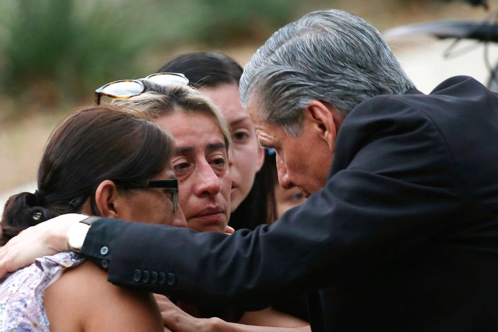The archbishop of San Antonio, Gustavo García-Siller, comforts families following the deadly school shooting at Robb Elementary School in Uvalde, Texas on Tuesday.