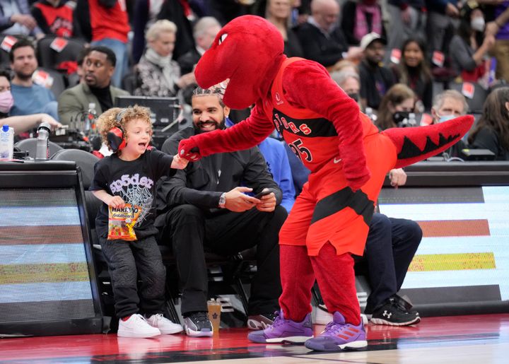 Drake, Adonis and the Raptors mascot at an April 7 game.