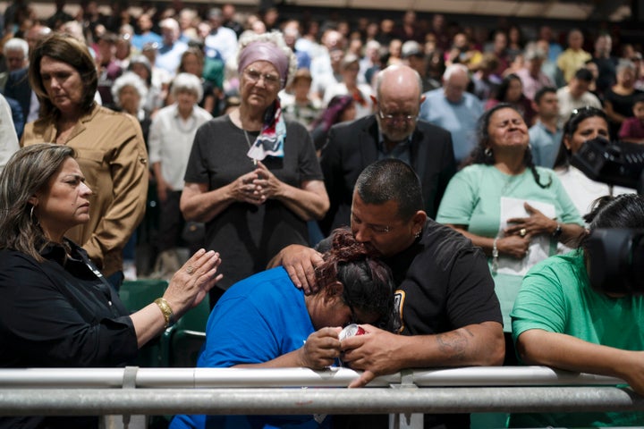 Two family members of one of the victims killed in Tuesday's shooting at Robb Elementary School comfort each other during a prayer vigil in Uvalde, Texas, Wednesday, May 25, 2022. (AP Photo/Jae C. Hong)