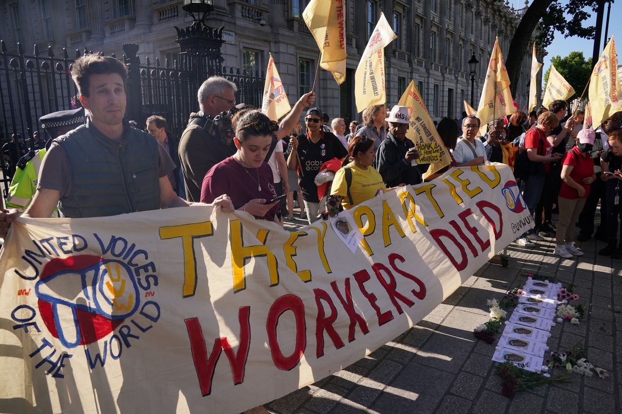 Cleaners stage a protest outside Downing Street in London, following revelations in Sue Gray's report.
