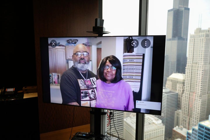 A monitor displays an image of Veldarin Jackson, Sr. and his mother, Janice Reed, who was one of the three senior victims who died in a Rogers Park building where residents complained of heat, at the office of attorney Larry R. Rogers, Jr., Tuesday, May 24, 2022, in Chicago.