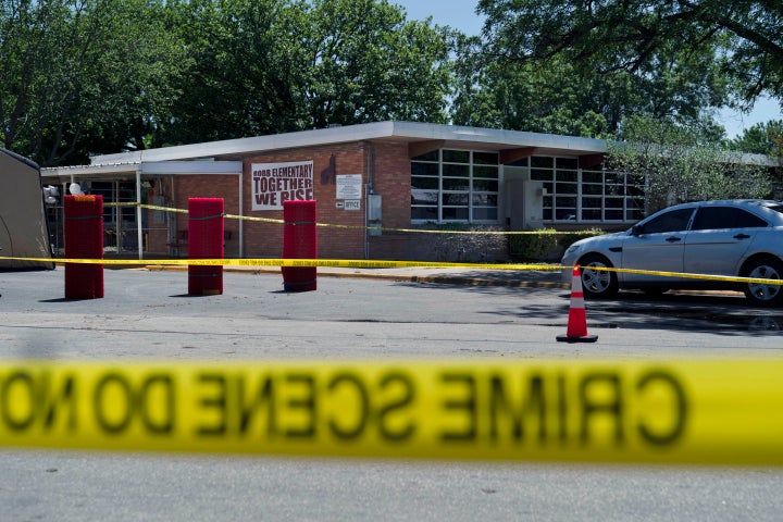 Crime scene tape surrounds Robb Elementary School after a mass shooting in Uvalde, Texas, May 25, 2022. (AP Photo/Jae C. Hong, File)