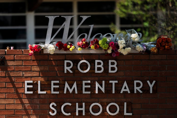 Flowers are placed around a welcome sign outside Robb Elementary School in Uvalde, Texas, Wednesday, May 25, 2022, to honor the victims killed in a shooting at the school a day earlier. In the aftermath of the elementary school massacre in Uvalde, Texas, schools around the U.S. have brought in additional security staff and restricted visitors as they've dealt with a new rash of copycat threats. (AP Photo/Jae C. Hong, File)