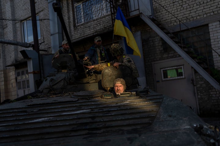 Ukrainian servicemen park a Russian BMP-2, an infantry combat vehicle, in the Kharkiv area, eastern Ukraine, on May 29, 2022. The Ukrainian military has been recovering abandoned Russian combat vehicles on the frontline to repair them and use them to their advantage. 