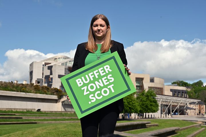 Scottish Green Party MSP Gillian Mackay holds a placard outside the Scottish Parliament in support of the creation of buffer zones around abortion clinics.