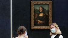 Man Disguised As Old Woman Throws Cake At Glass Protecting Mona Lisa