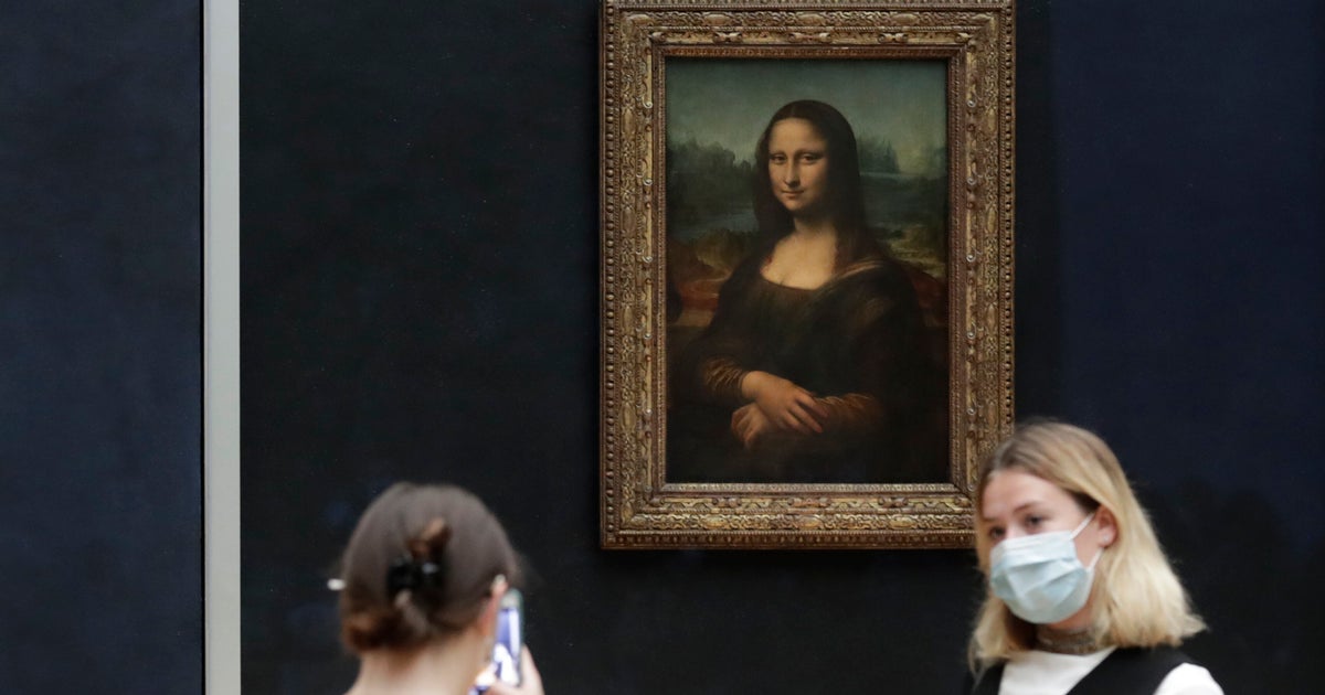 Man Disguised As Old Woman Throws Cake At Glass Protecting Mona Lisa