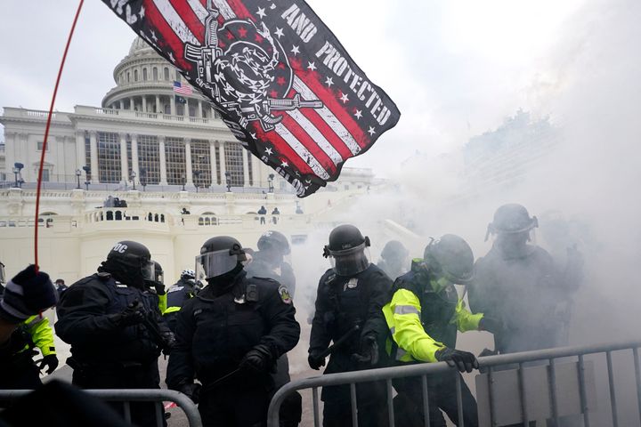 FILE - In this Jan. 6, 2021 file photo police hold off supporters of former President Donald Trump as they tried to break into the Capitol.